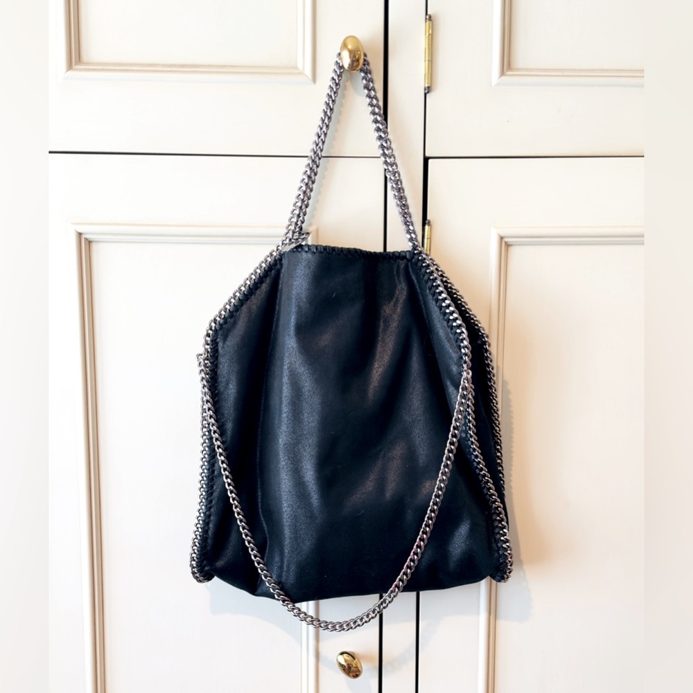 Black Chain Handbag. It also has a pouch inside. Lined in Peach Satin. NWOT